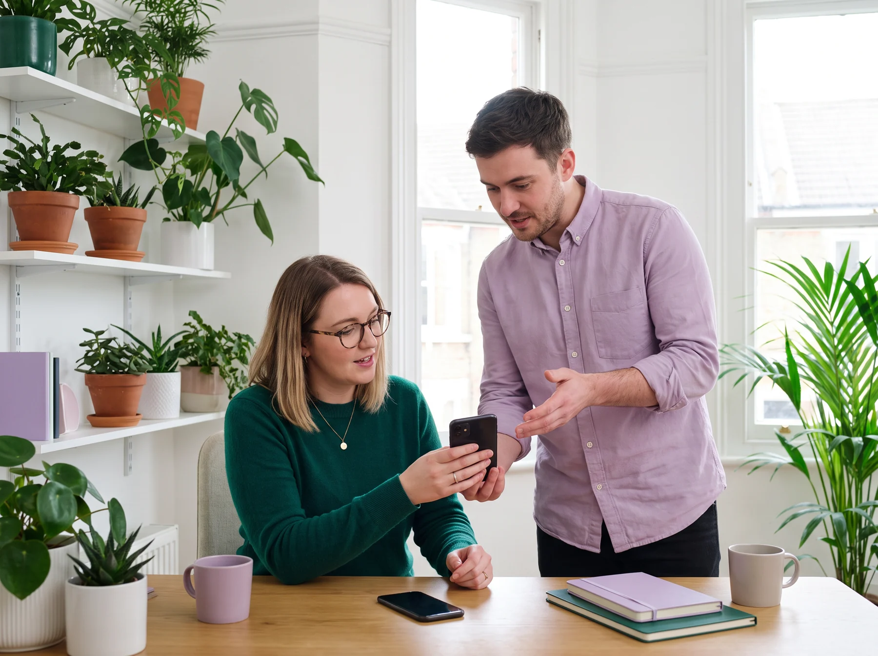 Two designers testing a phone prototype